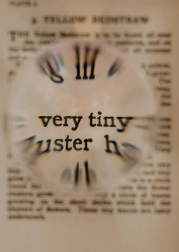 a close-up of a clock on a piece of paper